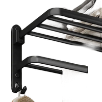 Black metal towel rack with multiple bars.