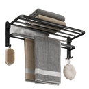 Black metal towel rack with towels and bath accessories.
