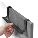 Black over-the-cabinet towel bar.
