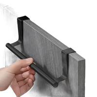 Black over-the-cabinet towel bar.