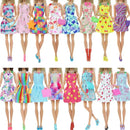 Barbie dolls in colorful dresses.
