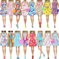 Barbie dolls in colorful dresses.