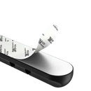 Black cable organizer with adhesive backing.