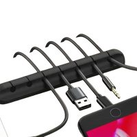 Black cable organizer with multiple slots.