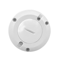 Round white plastic cover with screws.