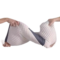 Stretched white quilted pillow.