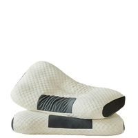 Two white neck support massage pillows with gray accents.