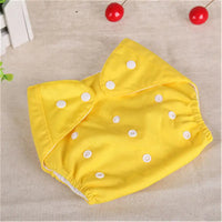 Yellow mesh style waterproof diaper with white snaps for newborn babies