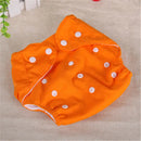 Orange cloth diaper with white snaps.