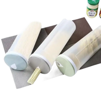 Three cylindrical food storage containers.