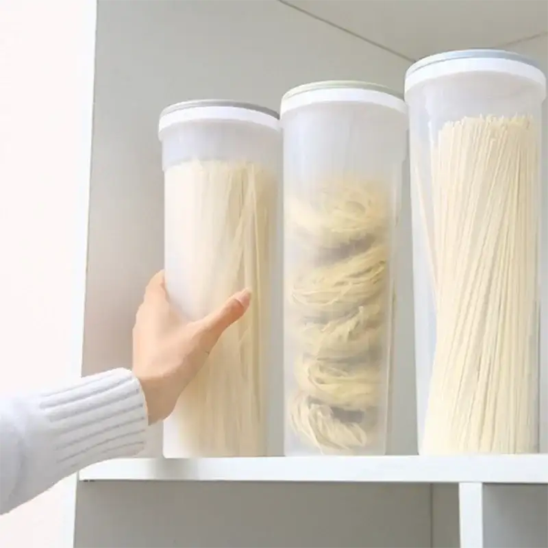 Three cylindrical food storage containers.