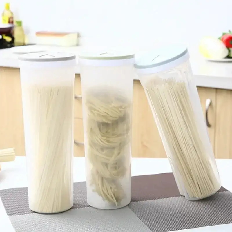 Three cylindrical containers filled with noodles.