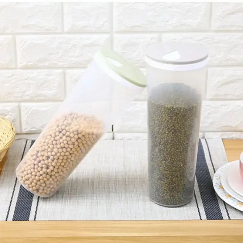 Two clear, cylindrical food storage containers.