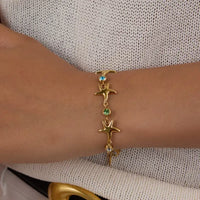 Starfish Elegance: Gold Zircon Titanium Bracelet - JDB0203013