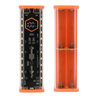 Orange-trimmed battery charger with digital display.