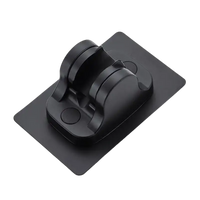 Black adhesive phone holder from Our Sweet Black Ventouse Noire Support Mural Selection, trendy and réglable
