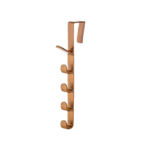 Copper-colored over-the-door hook rack.