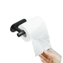 Black metal toilet paper holder with white roll.