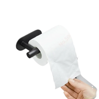Black metal toilet paper holder with white roll.