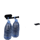 Black toilet paper holder with water bottles.