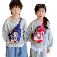 Two children wearing Paw Patrol sling bags.