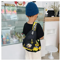 Black sling bag with yellow accents.