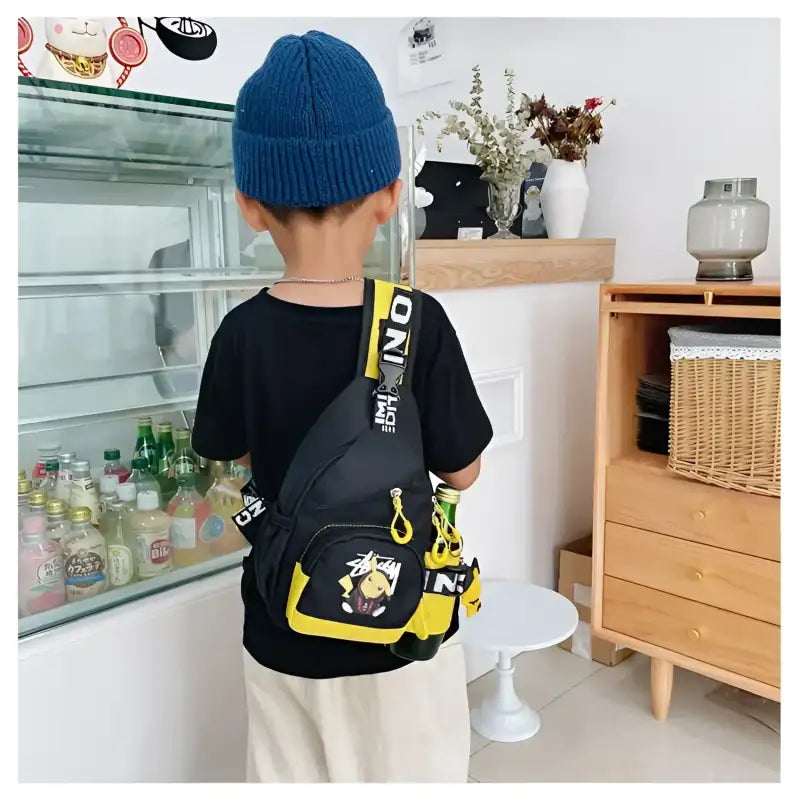 Child’s black and yellow sling bag.