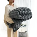 Gray, plush, ribbed blanket.