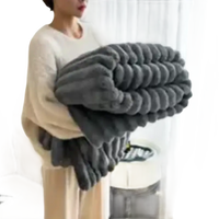 Gray, plush, ribbed blanket.