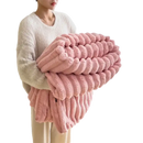 Pink plush ribbed blanket.