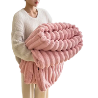 Pink plush ribbed blanket.