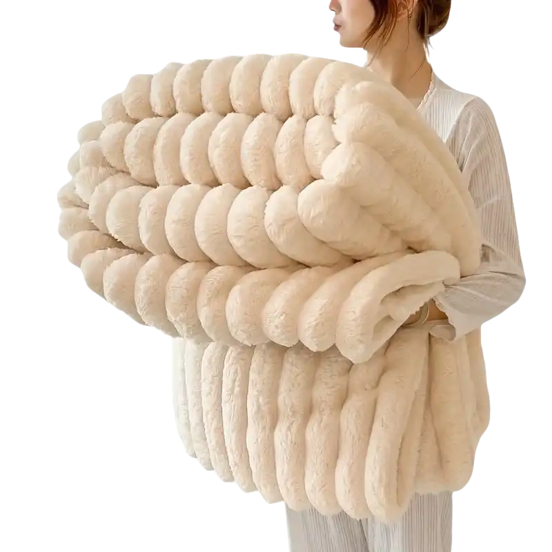 Cream-colored, plush, ribbed blanket.