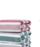 Stacked striped bath towels.