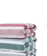 Stacked striped bath towels.