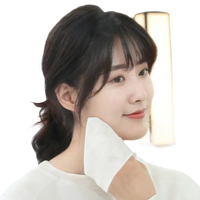 Woman wiping face with white cloth.