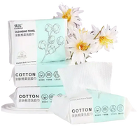 Stacked packages of cotton cleansing towels.