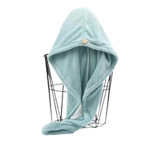 Light blue hooded towel with bear button.