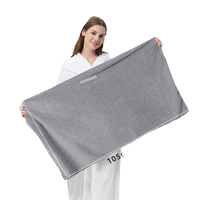 Gray textured towel with dimensions.