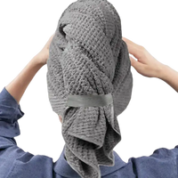 Gray waffle-weave hair towel wrap.