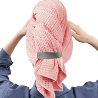 Pink waffle-weave hair towel.