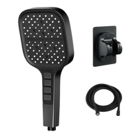Black handheld shower head with hose and mount.