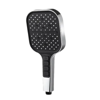 Chrome and black handheld shower head.