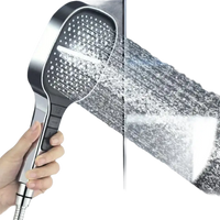 Handheld shower head with multiple spray patterns.