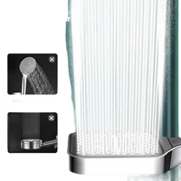 Square shower head with high-pressure water streams.