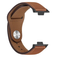 Brown leather watch band with black connectors.