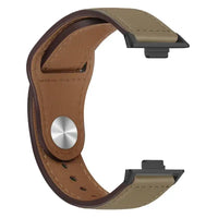 Leather watch band with black connectors.