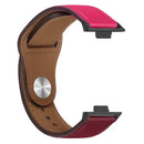 Pink and brown leather watch band.