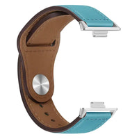 Turquoise and brown leather watch band.