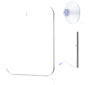 Rectangular mirror with rounded corners and suction cup.