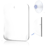 Rectangular mirror with rounded corners and suction cup.